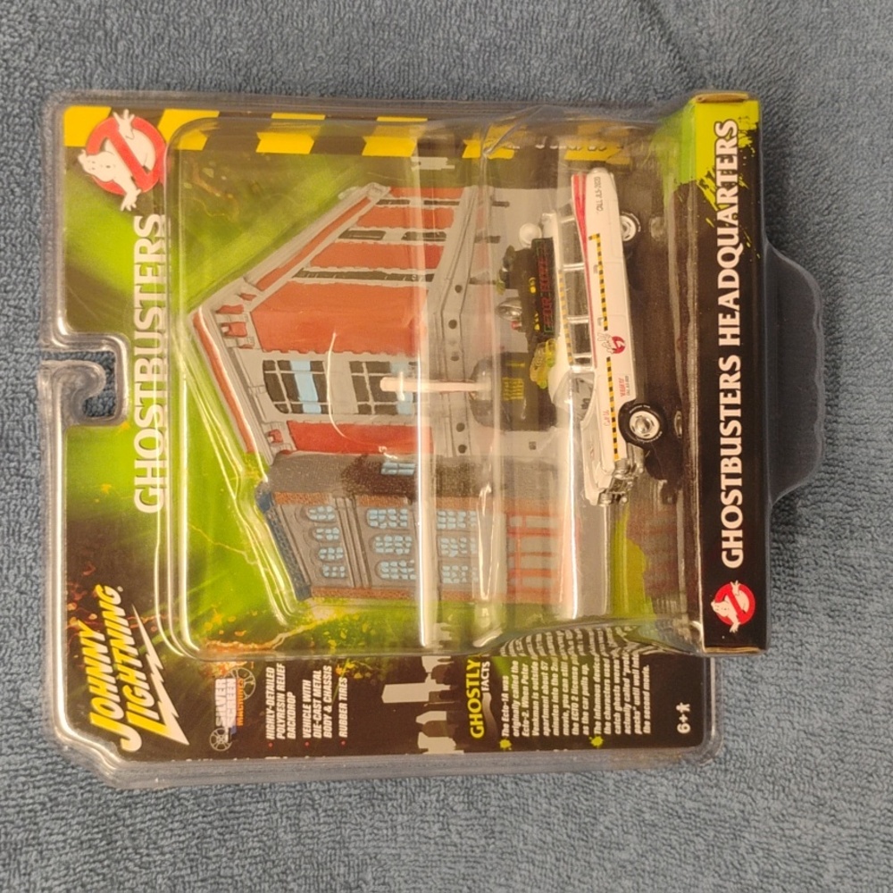 Johnny Lightning Die Cast Ghost busters Ecto 1 a with the firehouse display. $50